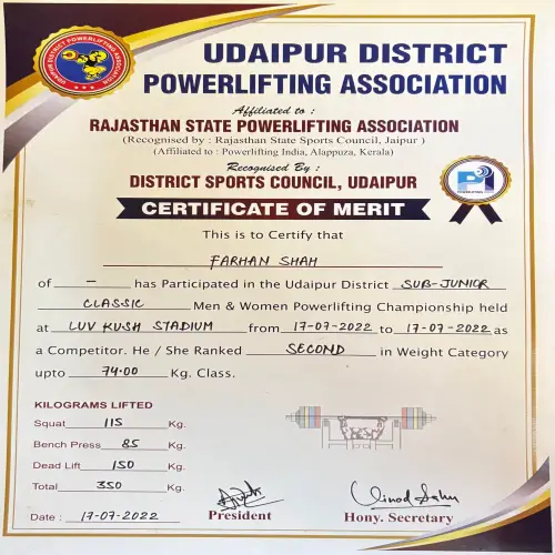 A merit certificate awarded to Farhan Shah for competing in the Udaipur District Sub-Junior Classic Powerlifting Championship held at Luv Kush Stadium from 17–19 July 2022.